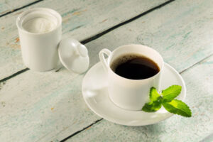 31358647 Herbal Sweetener Stevia In Powder Form And A Cup Of Coffee 300x200